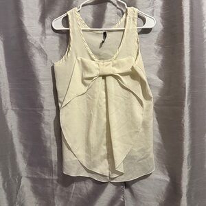 Ivory Sleeveless Blouse with Large Bow Design